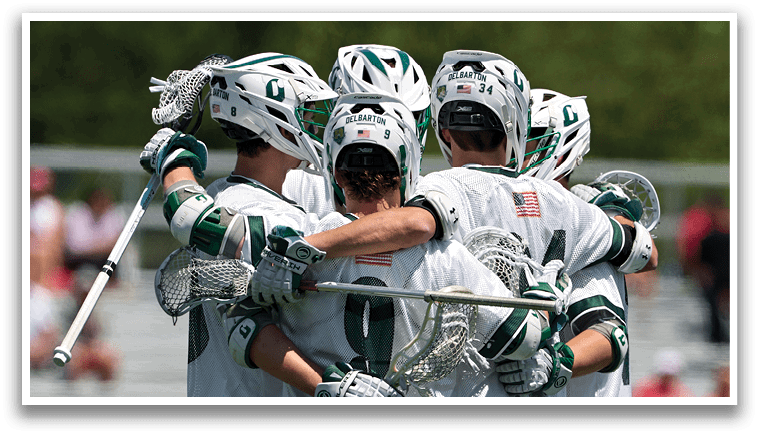 A group of lacrosse players hugging each other. Description generated by AI