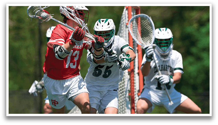 A man in a red shirt is running with a lacrosse stick. Description generated by AI