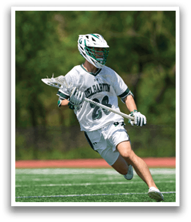 A man wearing a white shirt and green helmet running on a field. Description generated by AI