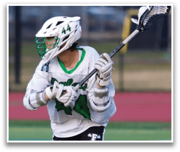 A man in a white shirt and black shorts is holding a lacrosse stick. AI generated content