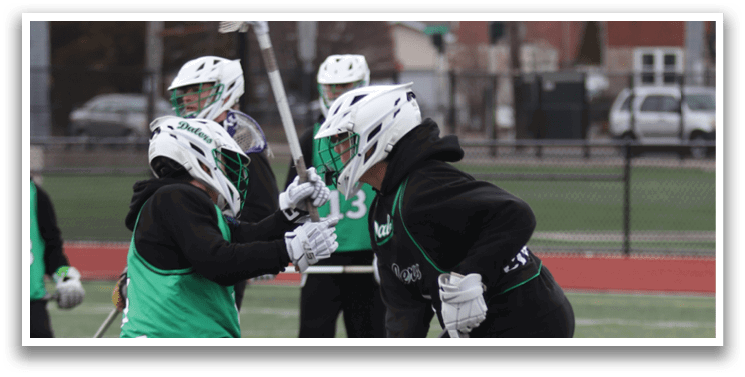 Two people playing lacrosse on a field. AI generated content