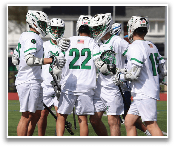 A group of men wearing white uniforms and green helmets. Description generated by AI