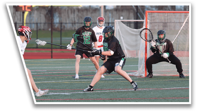 A group of people playing a game of lacrosse. Description generated by AI