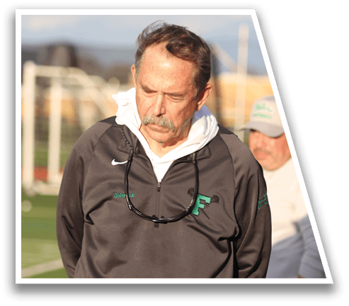 A man wearing a grey shirt and sunglasses. Description generated by AI