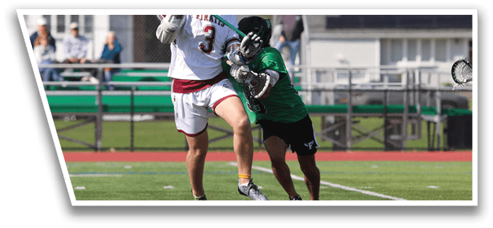 A man wearing a white and red jersey is jumping in the air to catch a lacrosse ball. Description generated by AI