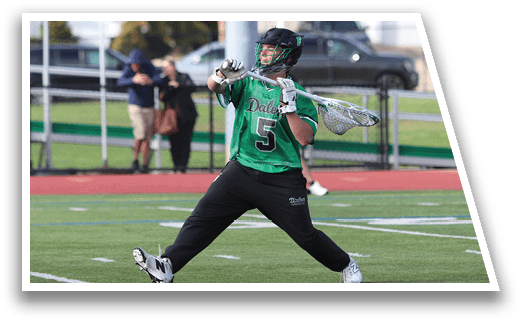 A man wearing a green shirt and black pants is playing a game of frisbee. Description generated by AI