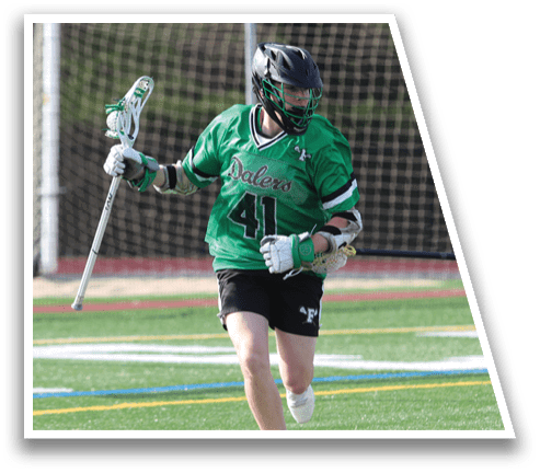 A man in a green shirt and black shorts is running with a baseball bat. Description generated by AI