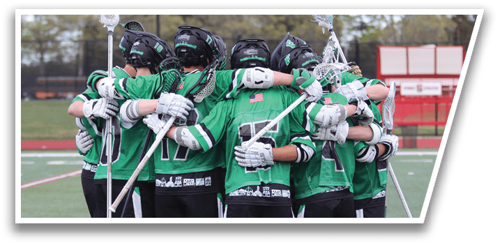 A group of people wearing green and white uniforms hugging each other on a field. Description generated by AI