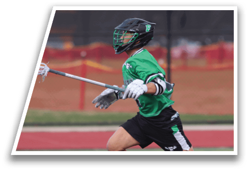 A man in a green shirt and black shorts is running with a white and black lacrosse stick. Description generated by AI