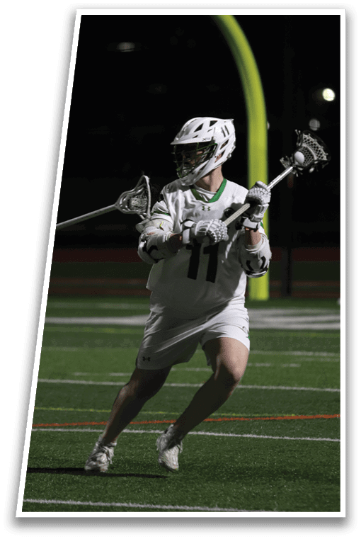 A man playing lacrosse. Description generated by AI