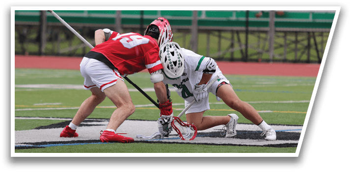 Two men playing hockey on a field. Description generated by AI