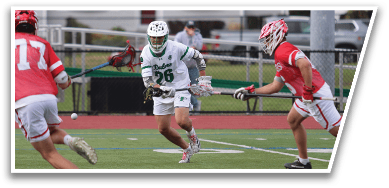 A group of people playing a game of lacrosse on a field. Description generated by AI