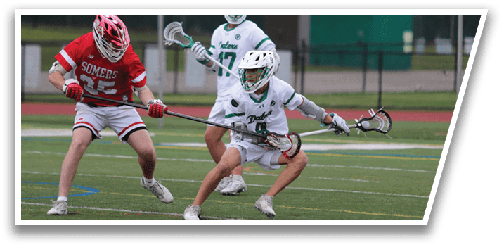 A man in a red jersey is playing lacrosse. Description generated by AI