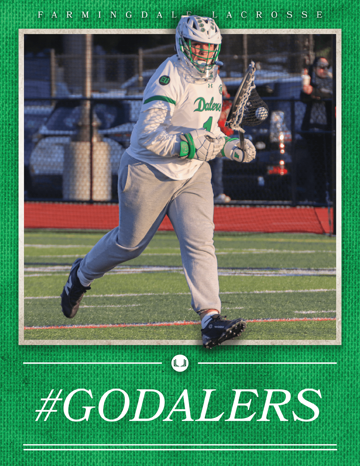 A man wearing a white and green shirt and grey pants holding a lacrosse stick. Description generated by AI