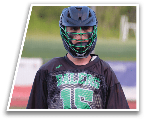 A young man wearing a black and green jersey with the number 15 on it. Description generated by AI