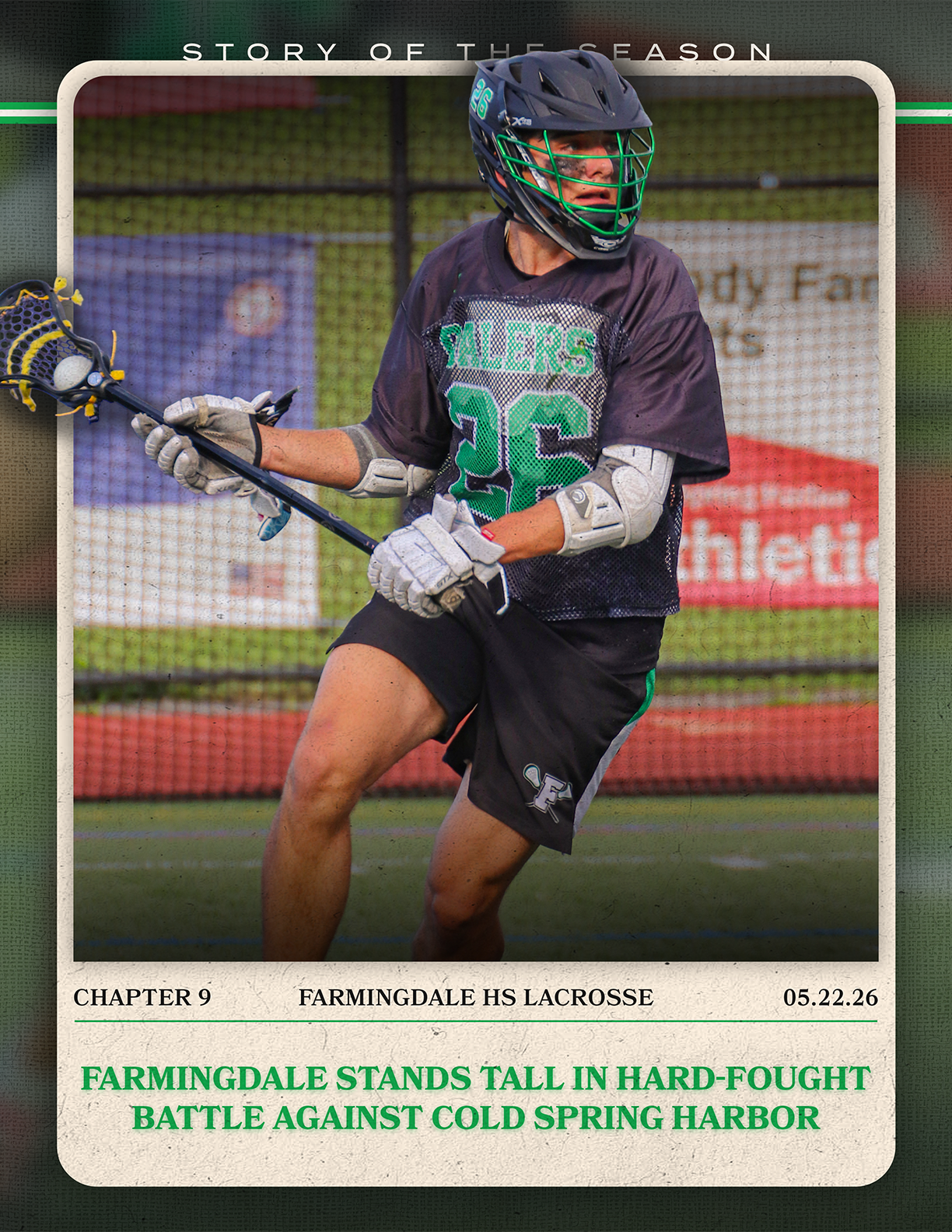 A man wearing a black and green jersey is holding a lacrosse stick. Description generated by AI