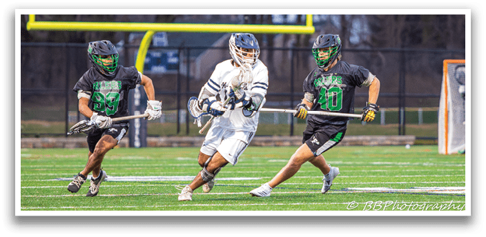 Two men are playing a game of lacrosse on a field. One man is running with a lacrosse stick, while the other man is running with a stick and a glove. AI generated content