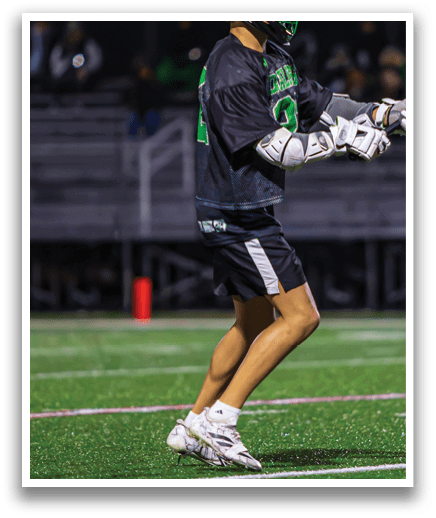 A man in a black shirt and white pants is holding a lacrosse stick and preparing to play. AI generated content