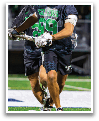 Two men playing lacrosse on a field. AI generated content