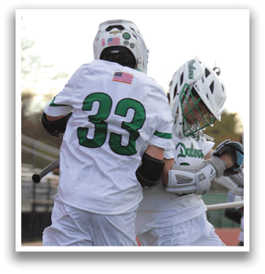 Two men wearing white uniforms jumping in the air. Description generated by AI