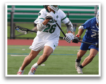 Two men playing lacrosse on a field. Description generated by AI