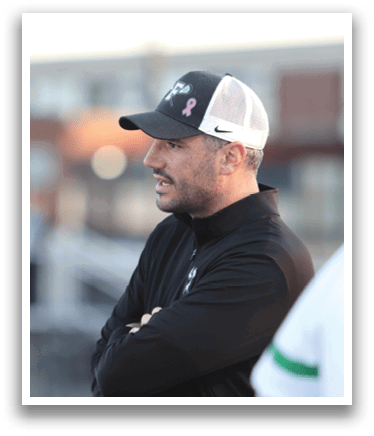 A man wearing a black jacket and a white hat. Description generated by AI
