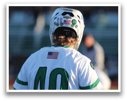 A man wearing a white jersey with the number 40 on it. Description generated by AI