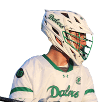 A man holding a lacrosse stick. Description generated by AI
