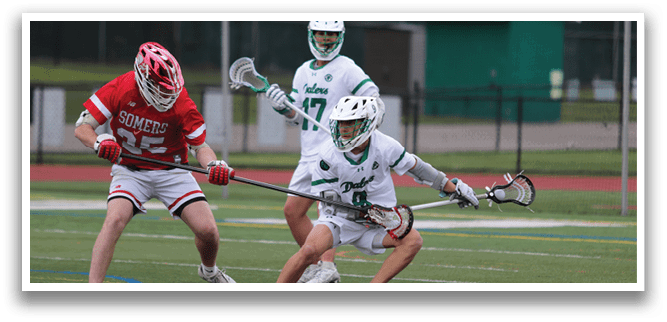A man in a red and white uniform is playing lacrosse. Description generated by AI