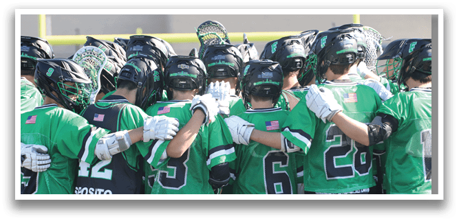 A group of people wearing green shirts and black shorts. Description generated by AI