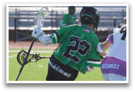A man wearing a green jersey is falling to the ground while playing lacrosse. Description generated by AI