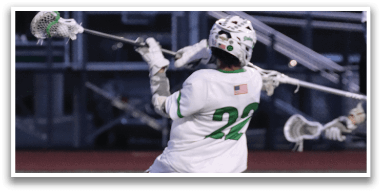 A man is diving on the ground with a white shirt and green number 12 on it. Description generated by AI