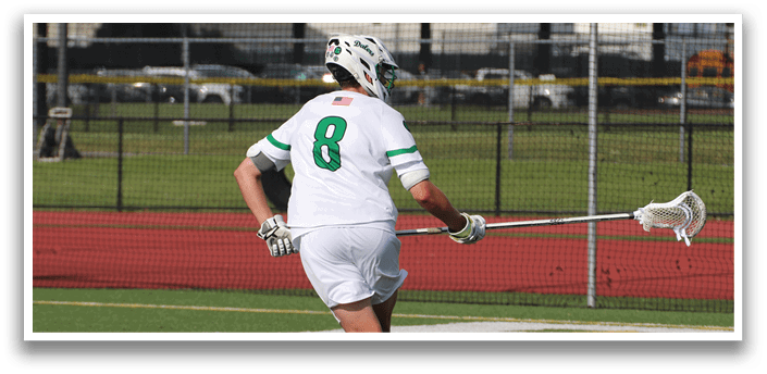 Two men are playing a game of lacrosse on a field. One man is running with a lacrosse stick, while the other man is running with a stick and a glove. AI generated content