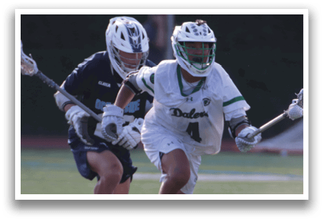 Two men playing lacrosse on a field. One man is holding a stick and the other is holding a stick and a ball. AI generated content