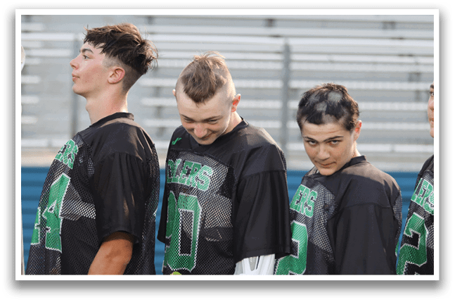 A group of people playing a game of lacrosse on a field. AI generated content