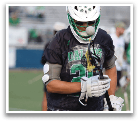 A man in a black shirt and white pants is holding a lacrosse stick and preparing to play. AI generated content