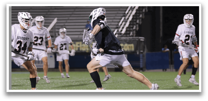 A man in a black shirt and white shorts is running on a field. Description generated by AI