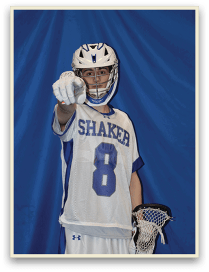 A young man wearing a Shaker football jersey stands in front of a blue backdrop. AI generated content