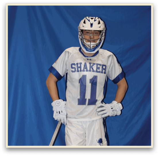 A man wearing a white and blue jersey and holding a lacrosse stick. AI generated content