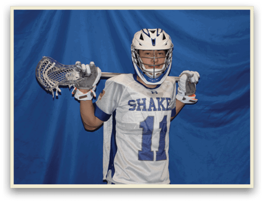 A man wearing a white and blue jersey holds a lacrosse stick. AI generated content
