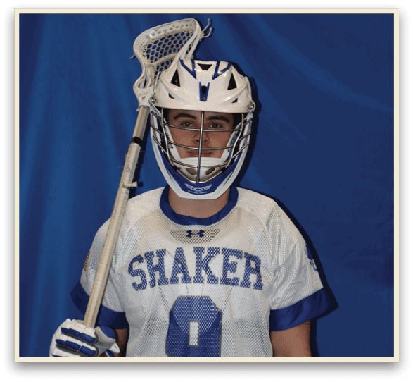 A young man wearing a Shaker lacrosse jersey holds a lacrosse stick. AI generated content