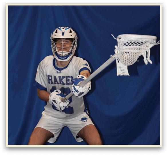 A man wearing a white uniform and a blue helmet holds a lacrosse stick. AI generated content