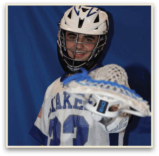 A young man wearing a Lake 13 jersey and a helmet is holding a lacrosse stick. AI generated content