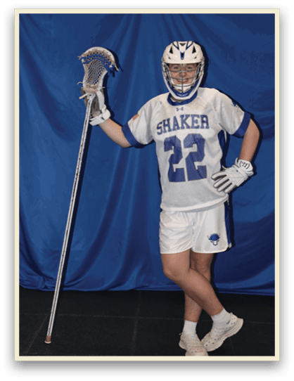 A man wearing a Shaker jersey holds a lacrosse stick. AI generated content