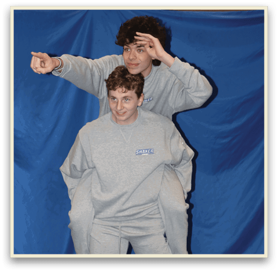 Two people are posing for a picture, one is holding the other's legs. AI generated content