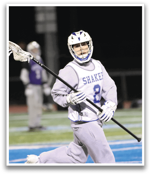 A person wearing a grey uniform is holding a lacrosse stick and walking on a field. AI generated content