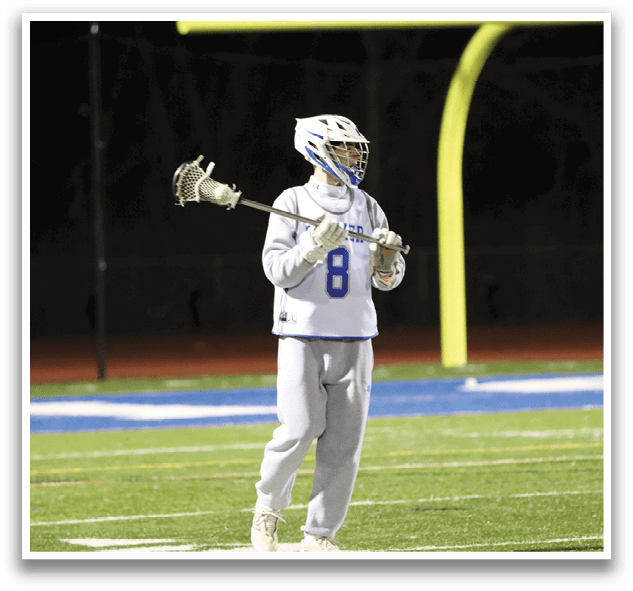 A person wearing a white uniform and a blue helmet is holding a lacrosse stick. AI generated content