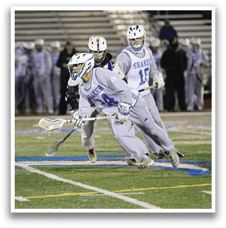 A group of young men playing lacrosse on a field. AI generated content