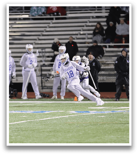 A group of people are playing a game of lacrosse on a field. AI generated content