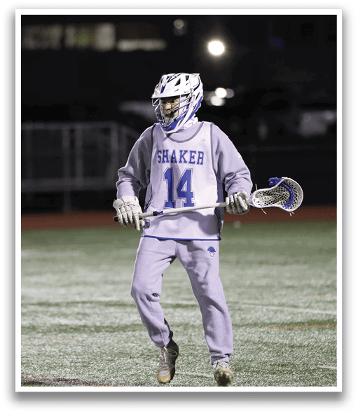 A person wearing a grey uniform and a helmet is holding a lacrosse stick. AI generated content
